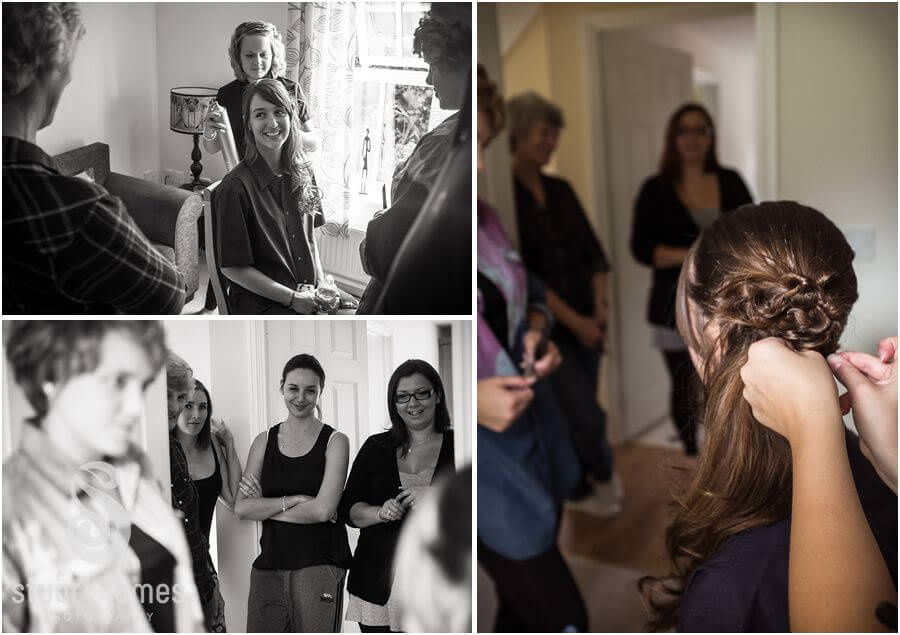 Capturing the bride getting hair and makeup prepared ahead of wedding at The Barns in Cannock by Reportage Wedding Photographer Stuart James