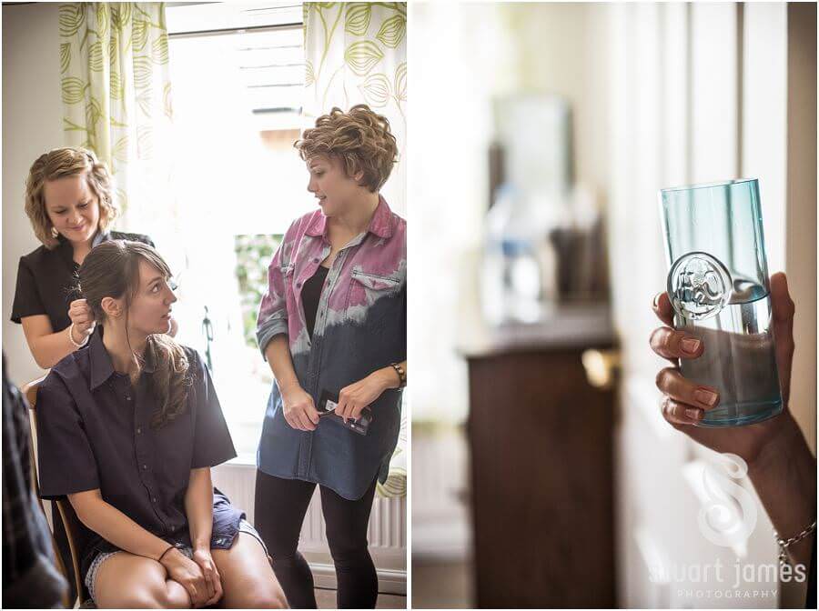 Capturing the bride getting hair and makeup prepared ahead of wedding at The Barns in Cannock by Reportage Wedding Photographer Stuart James