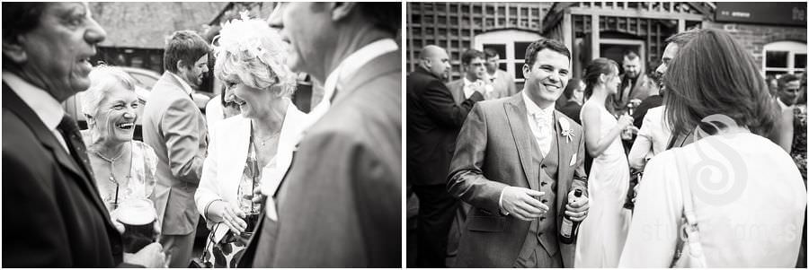 Guests enjoying drinks outside The Barns in Cannock by Reportage Wedding Photographer Stuart James