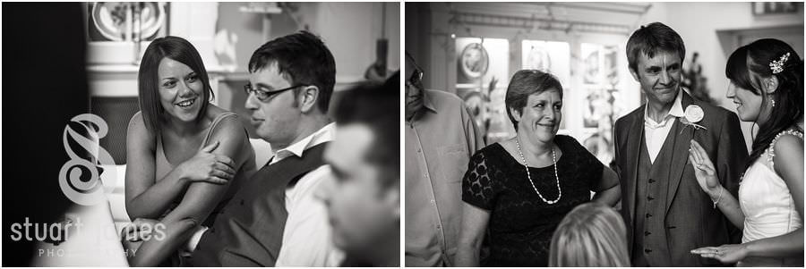 Candid photographs of the guests enjoying the evening reception at The Barns in Cannock by Modern Creative Wedding Photographer Stuart James