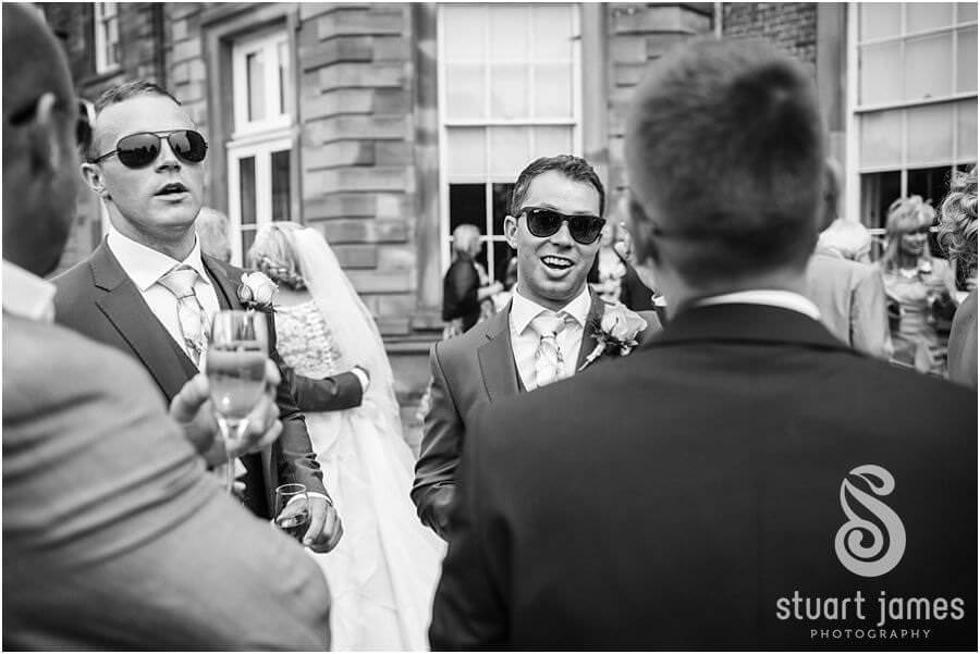 Capturing the guests enjoying the drinks reception at Weston Park in Staffordshire by Candid Wedding Photographer Stuart James
