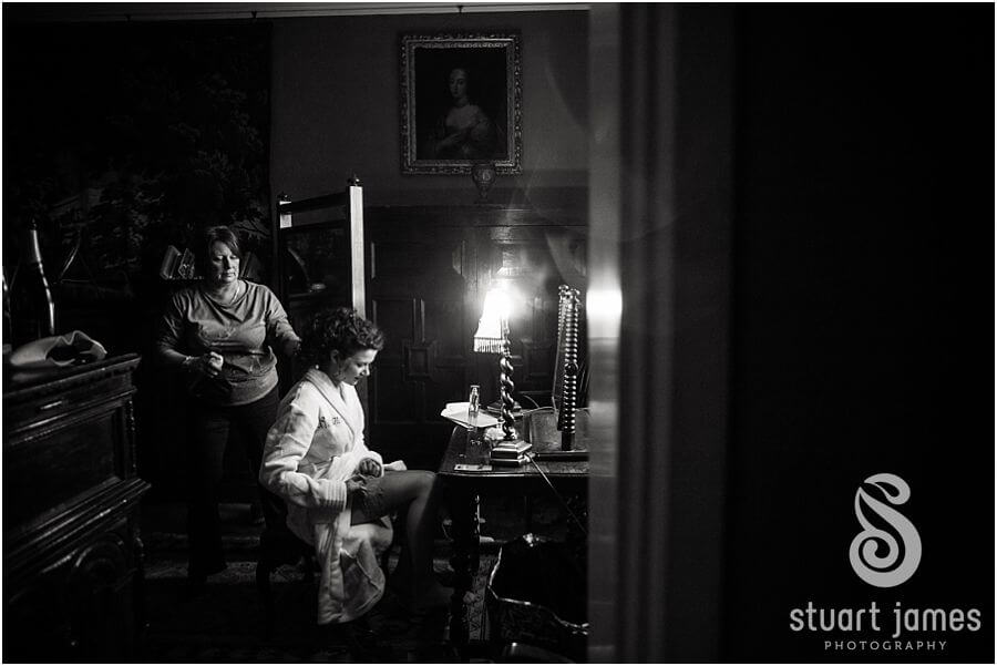 Bride and groom getting ready for their wedding at Muncaster Castle in Cumbria by Documentary Wedding Photographer Stuart James