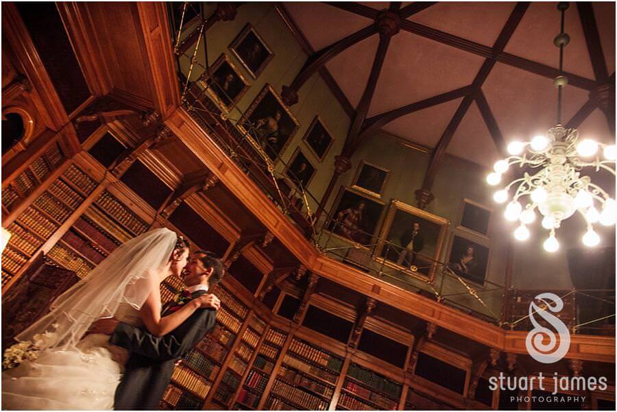 Stunning portraits in library at Muncaster Castle in Ravenglass by Documentary Wedding Photographer Stuart James