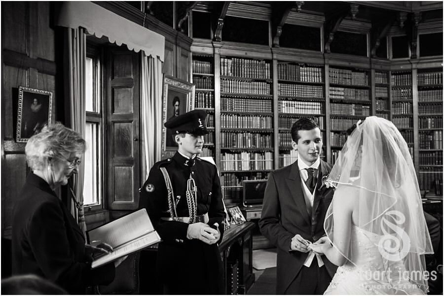 Unobtrusive natural wedding photography at Muncaster Castle in Ravenglass during civil ceremony in library by Wedding Photojournalist Stuart James