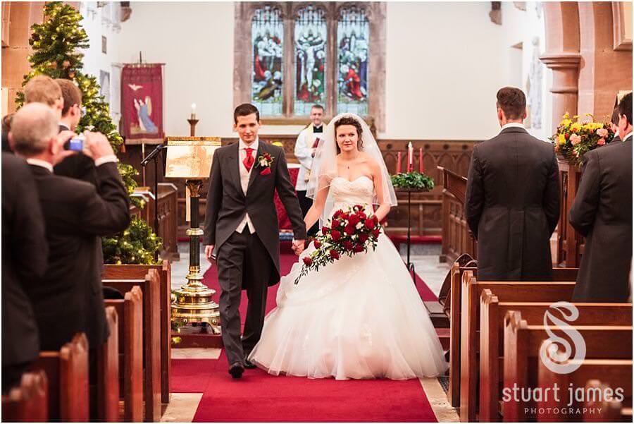 Wedding blessing at Muncaster Church in grounds of Muncaster Castle in Cumbria captured by Wedding Photojournalist Stuart James