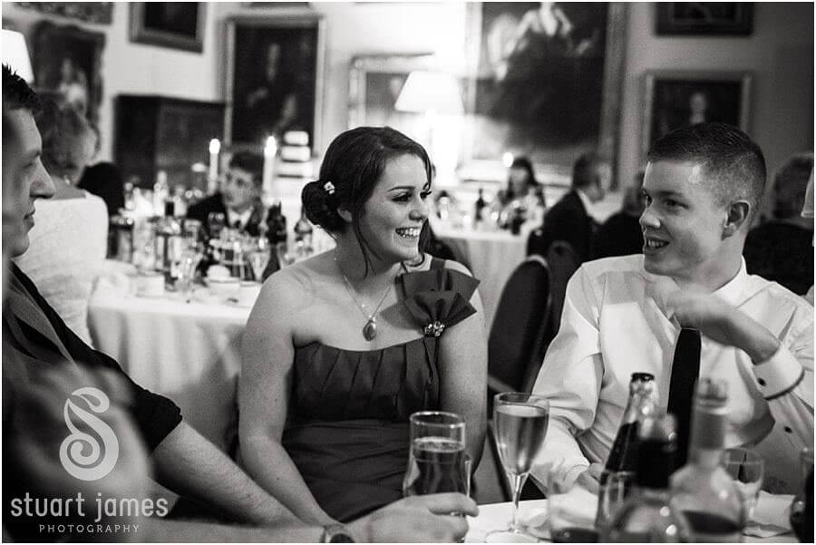 Guests enjoy the intimate wedding reception at Muncaster Castle in Ravenglass by Documentary Wedding Photographer Stuart James