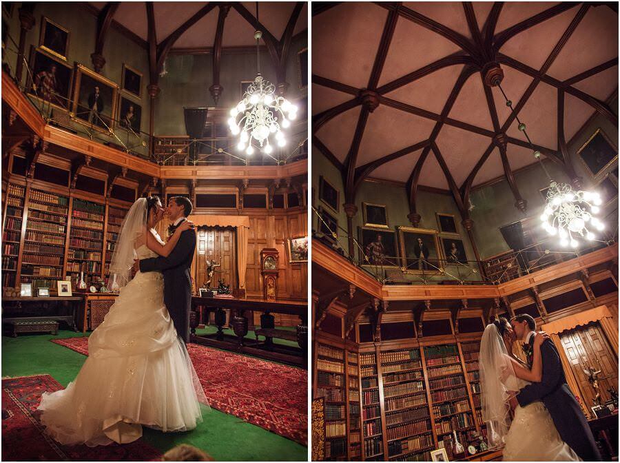 Beautiful portraits of Bride + Groom in library at Muncaster Castle in Ravenglass by Documentary Wedding Photographer Stuart James