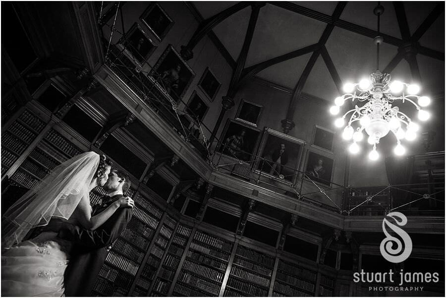 Creative wedding portraits of Bride + Groom in library at Muncaster Castle in Ravenglass by Cumbria Wedding Photographer Stuart James