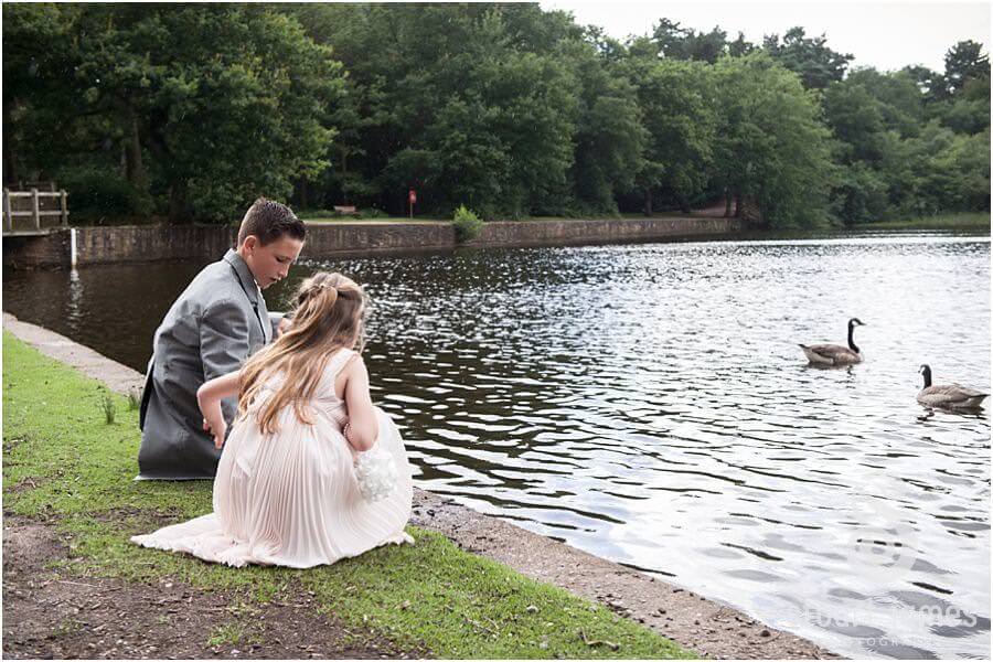 Natural photographs of guests enjoying drinks reception at The Boat House, Sutton Park in Sutton Coldfield by Candid Wedding Photographer Stuart James