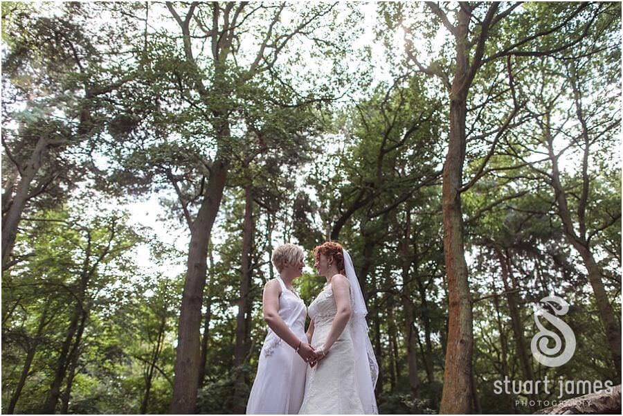 Creative classical photos of couple by Bracebridge Pool at The Boat House, Sutton Park in Sutton Coldfield by Documentary Wedding Photographer Stuart James