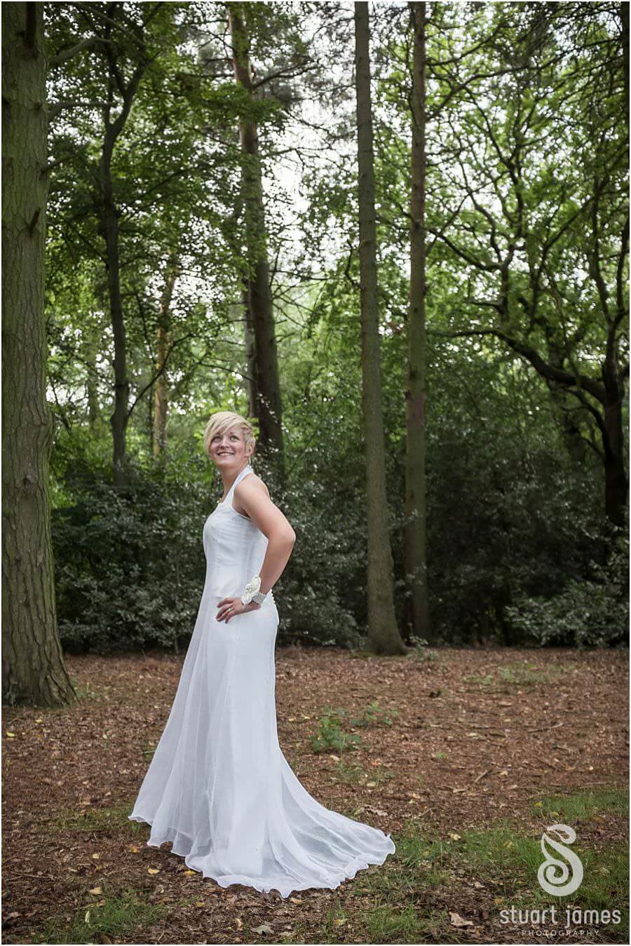 Creative classical photos of couple by Bracebridge Pool at The Boat House, Sutton Park in Sutton Coldfield by Documentary Wedding Photographer Stuart James