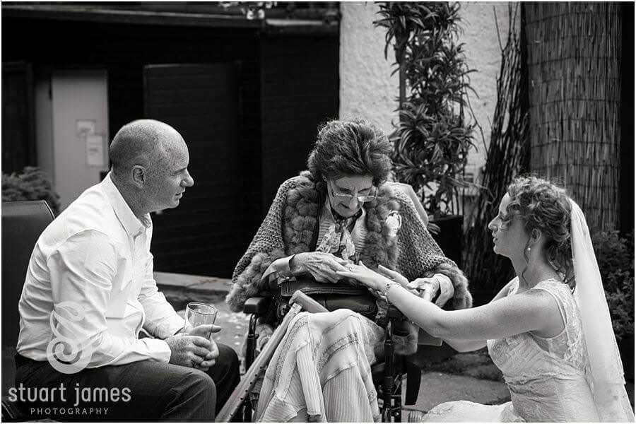 Candid photographs of guests enjoying drinks reception at The Boat House, Sutton Park in Sutton Coldfield by Midlands Wedding Photographer Stuart James