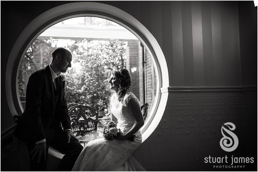Beautiful portraits of Bride and Groom on rainy day at The Fairlawns in Aldridge by Reportage Wedding Photographer Stuart James