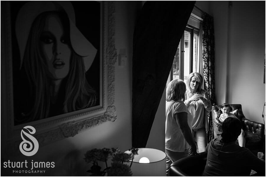 Capturing the atmosphere of a wedding morning during bridal preparations at home before wedding at Weston Park in Staffordshire by Reportage Wedding Photographer Stuart James