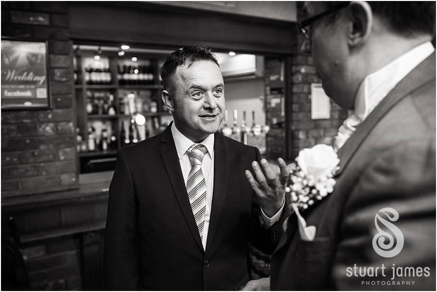 Fun unobtrusive candid photographs during drinks reception at The Moat House in Acton Trussell by Recommended Wedding Photographer Stuart James