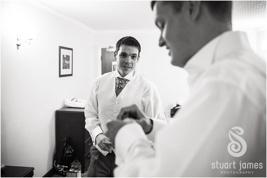 Candid photography of bridal hair and makeup preparations at hotel before wedding at Twycross Zoo in Atehrstone by Warwickshire Wedding Photographer Stuart James