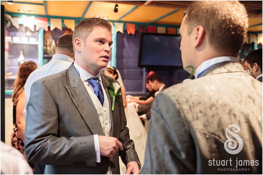 Reportage photograph of guests relaxing and enjoying wedding drinks reception at Twycross Zoo in Atherstone by Reportage Wedding Photographer Stuart James