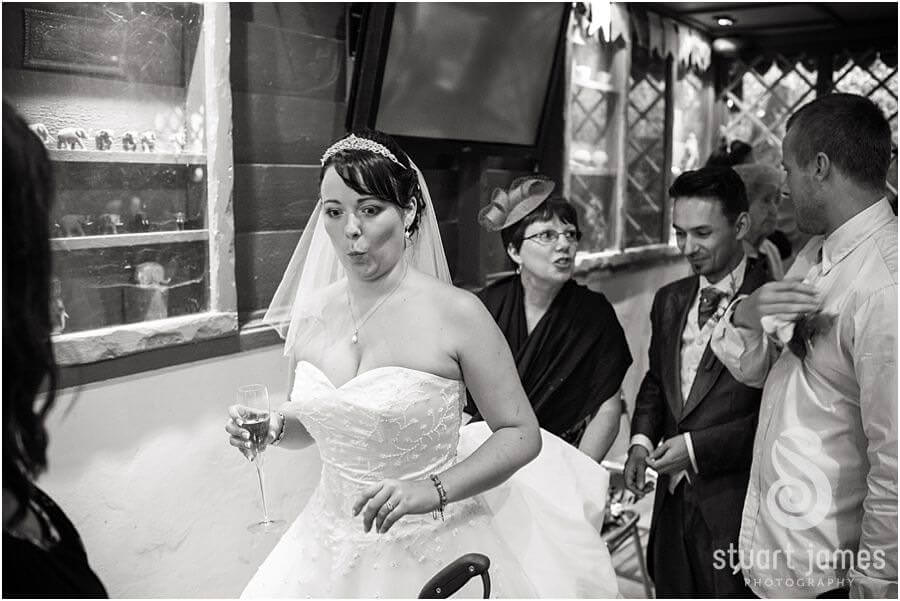 Capturing candid photographs of guests enjoying drinks reception at Uda Walawe at Twycross Zoo in Atherstone by Reportage Wedding Photographer Stuart James