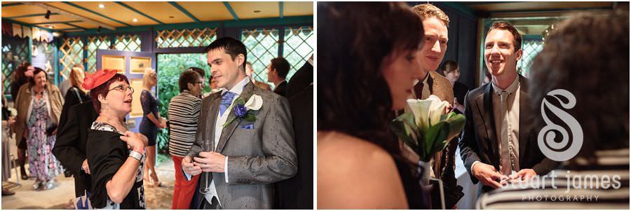 Capturing candid photographs of guests enjoying drinks reception at Uda Walawe at Twycross Zoo in Atherstone by Reportage Wedding Photographer Stuart James
