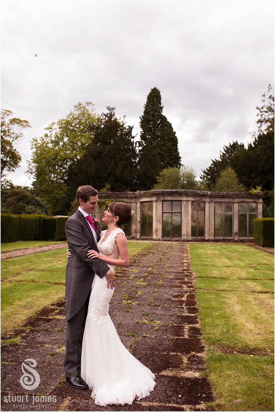 Relaxed beautiful wedding photographs of the Bride and Groom around the grounds at Sandon Hall near Stafford by Stafford Wedding Photographer Stuart James