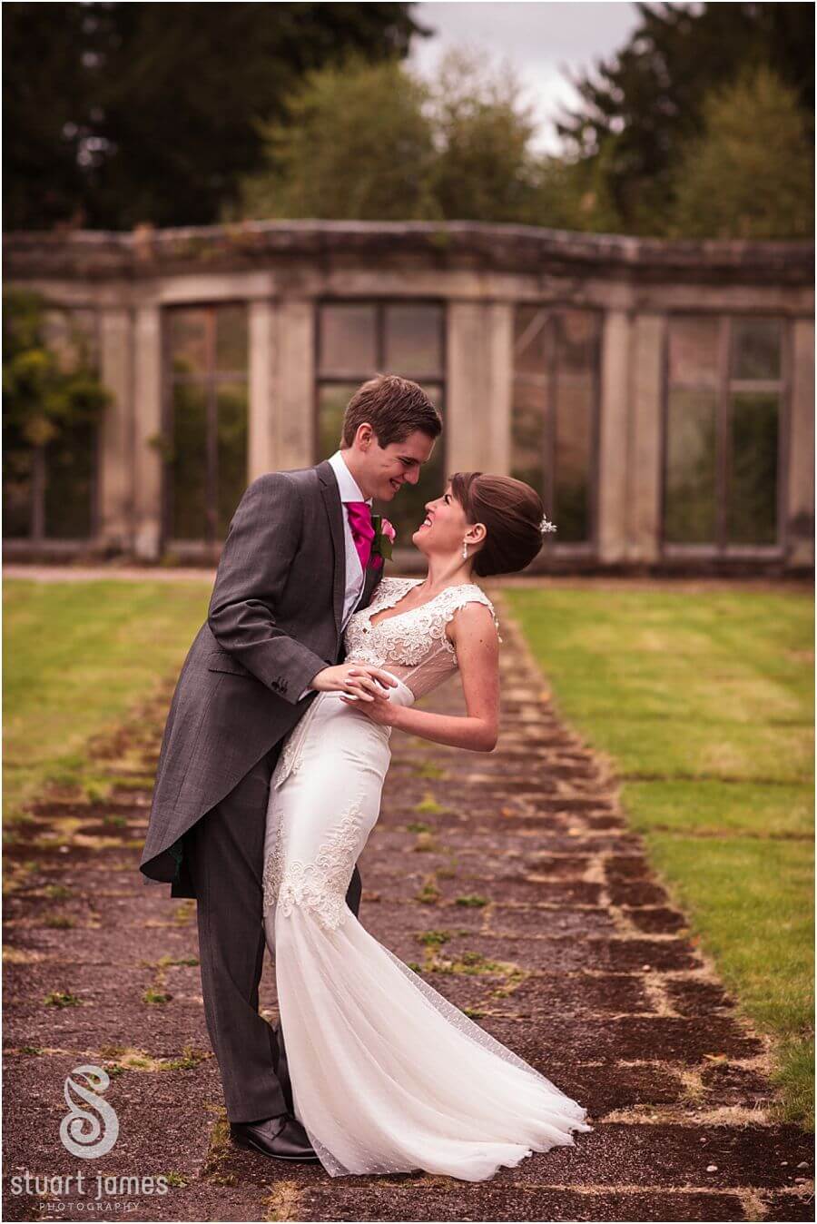 Relaxed beautiful wedding photographs of the Bride and Groom around the grounds at Sandon Hall near Stafford by Stafford Wedding Photographer Stuart James
