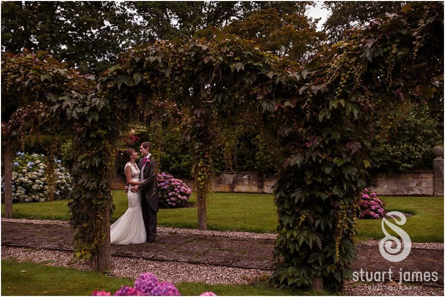 Creative wedding photographs of the couple around the grounds of Sandon Hall near Stafford by Stafford Wedding Photographer Stuart James