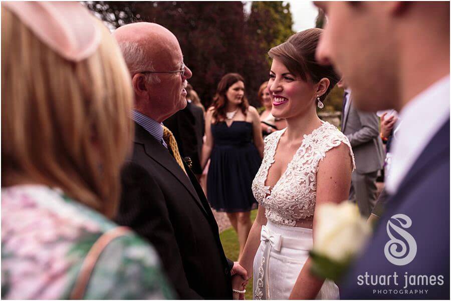 Reportage photographs of the guests enjoying the wedding reception at Sandon Hall near Stafford by Stafford Wedding Photographer Stuart James