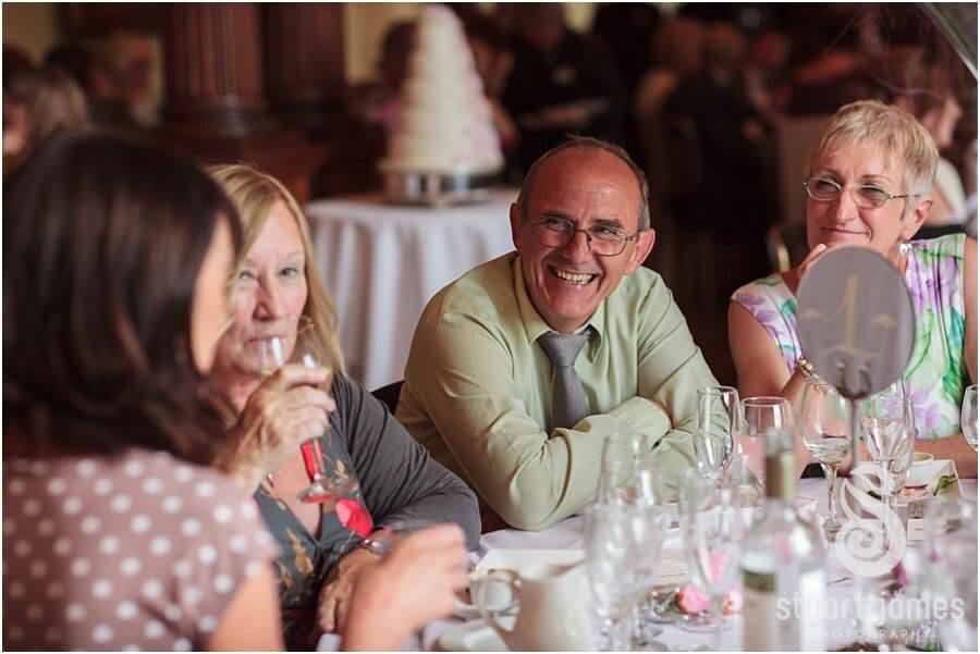 Reportage photographs of the guests enjoying the wedding breakfast at Sandon Hall near Stafford by Stafford Wedding Photographer Stuart James