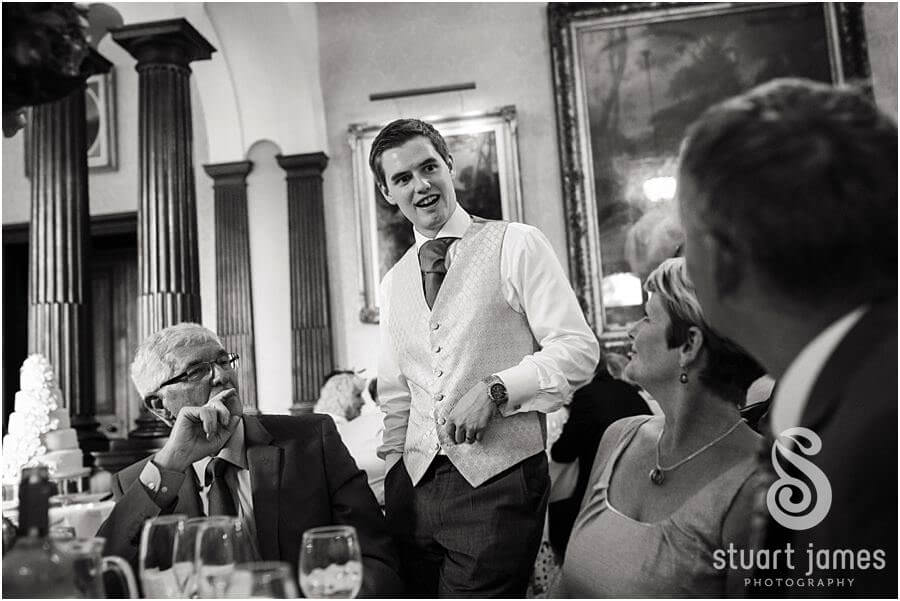 Reportage photographs of the guests enjoying the wedding breakfast at Sandon Hall near Stafford by Stafford Wedding Photographer Stuart James