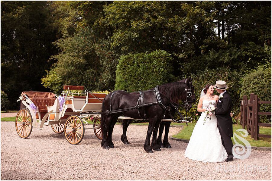 Stunning horse and carriage wedding transport for the bride and groom, here arriving at Bride's parents home near Bromsgrove by Recommended Worcester Wedding Photographer Stuart James