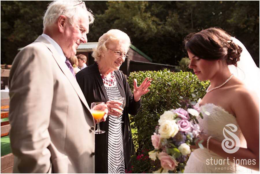 Wedding photographs that show your guests enjoying the wedding reception at Bride's parents home near Chaddesley Corbet by Reportage Wedding Photographer Stuart James