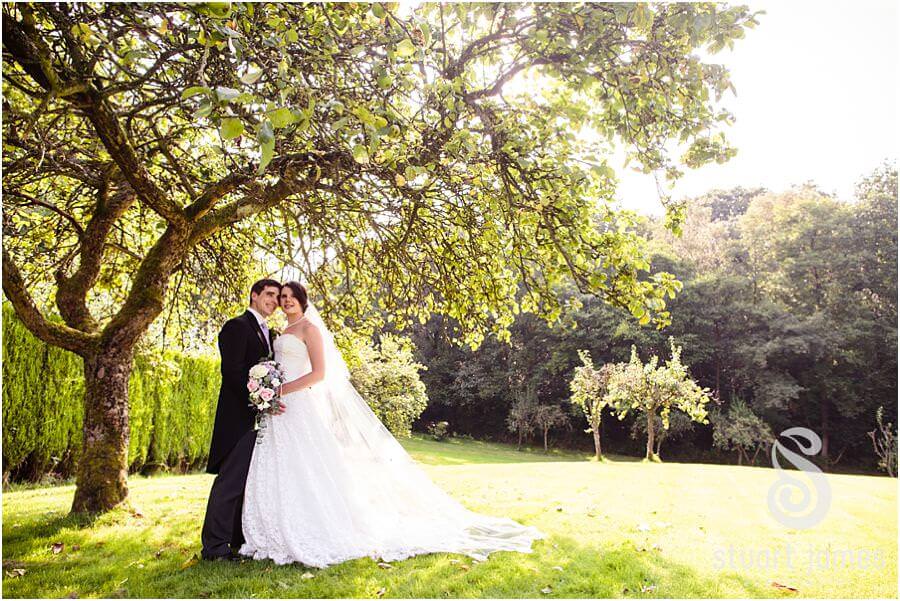 Taking a few minutes from the wedding reception, these beautiful portraits were created of the Bride and Groom around the grounds of Bride's parents home near Chaddesley Corbet by Stylish Wedding Photographer Stuart James