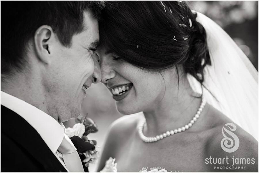 Natural feeling couple portraits of Bride and Group around grounds of Bride's parents home near Chaddesley Corbet by Stylish Wedding Photographer Stuart James