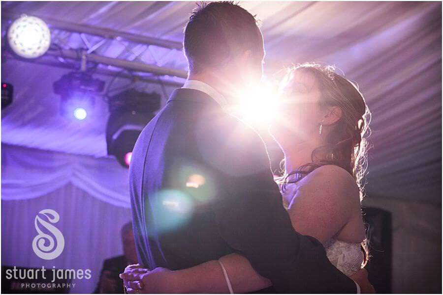 Creating timeless memorable photographs of the exciting evening reception in the marquee at Wroxhall Hall in Warwickshire by Warwickshire Documentary Wedding Photographer Stuart James