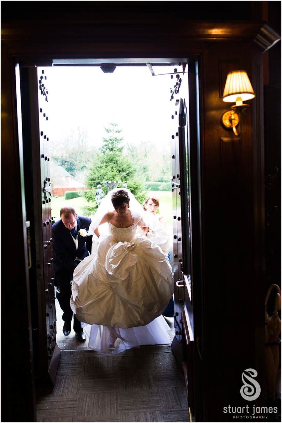 Capturing the emotional arrival of the bride at Rowton Castle in Shrewsbury by Shrewsbury Documentary Wedding Photographer Stuart James