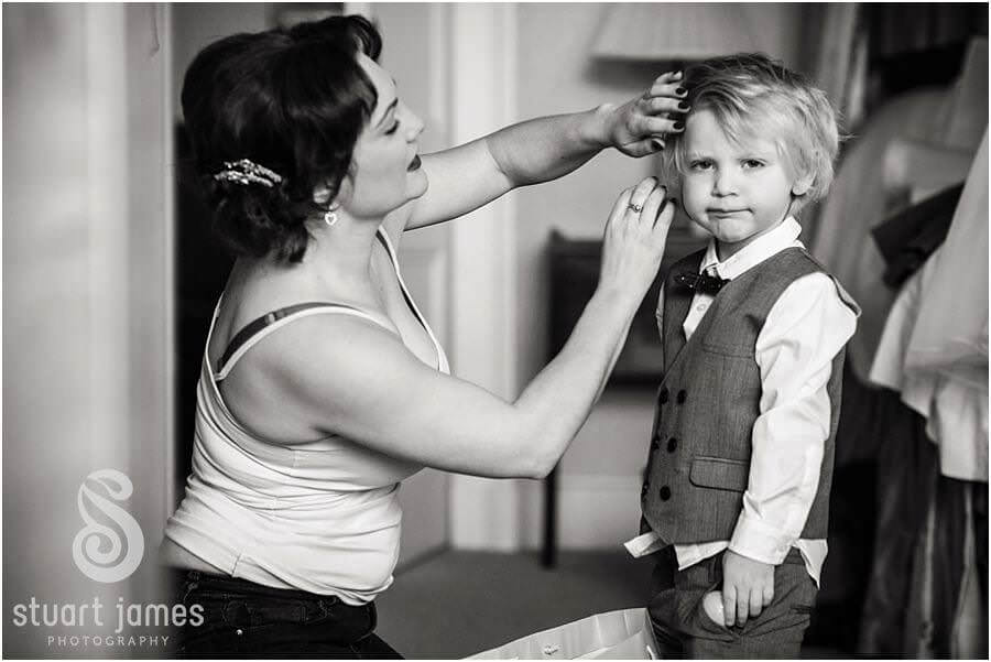 Candid photos of bridal makeup and preparations at Sandon Hall in Stafford by Documentary Wedding Photographer Stuart James