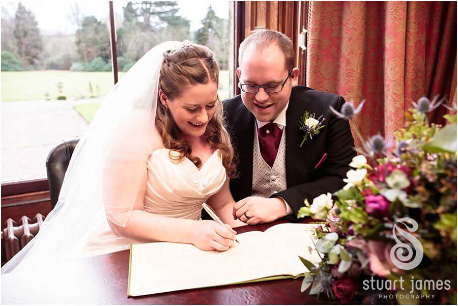 Beautiful photos of the wedding ceremony in the library at Sandon Hall in Stafford by Stafford Reportage Wedding Photographer Stuart James