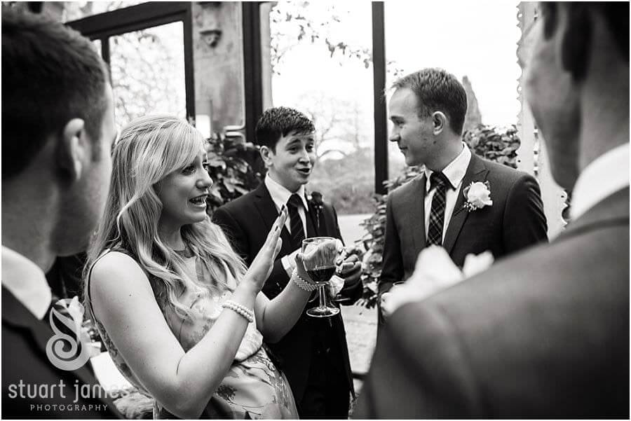 Candid photos of the guests enjoying the drinks reception at Sandon Hall in Stafford by Stafford Wedding Photographer Stuart James