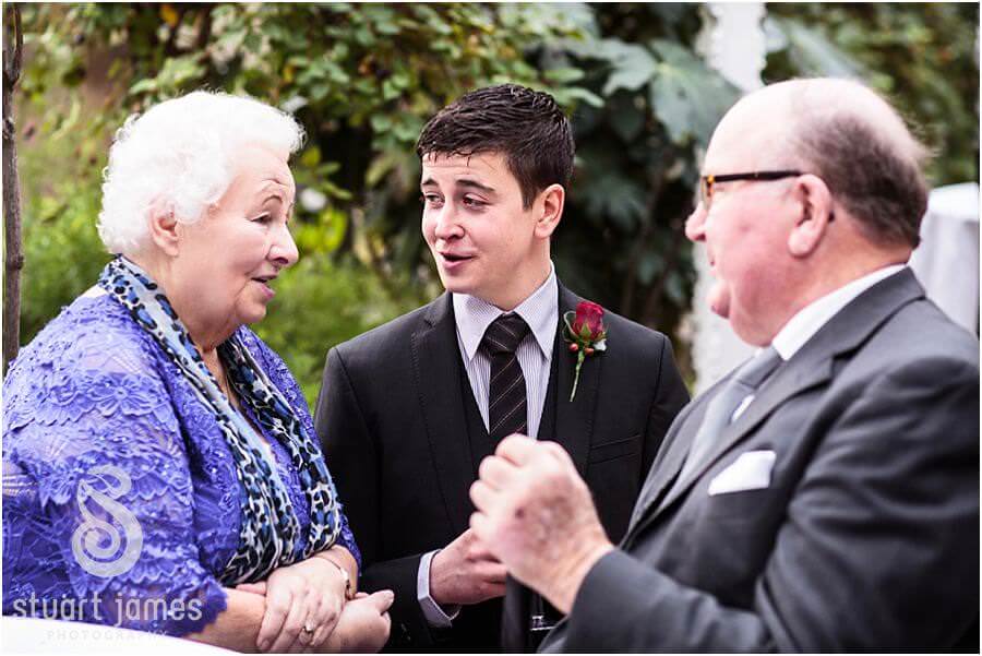 Natural candids of guests during wedding reception at Sandon Hall in Stafford by Stafford Wedding Photographer Stuart James