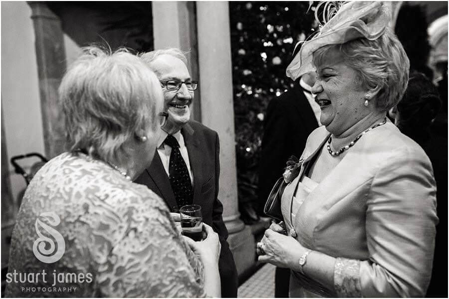 Creative candid photos of the guests enjoying wedding reception at Sandon Hall in Stafford by Award Winning Stafford Wedding Photographer Stuart James