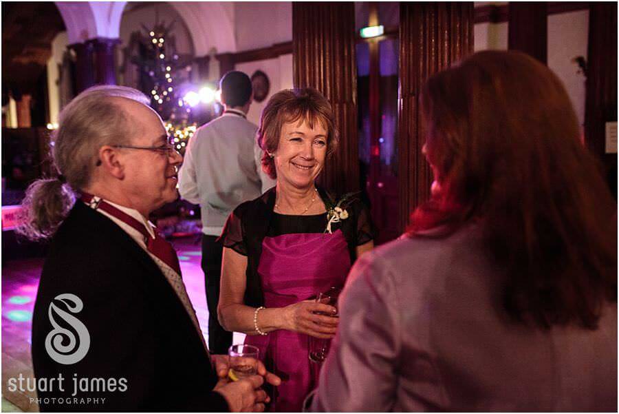 Evening guests captured in beautiful reportage photographs of the evening reception at Sandon Hall in Stafford by Award Winning Stafford Wedding Photographer Stuart James