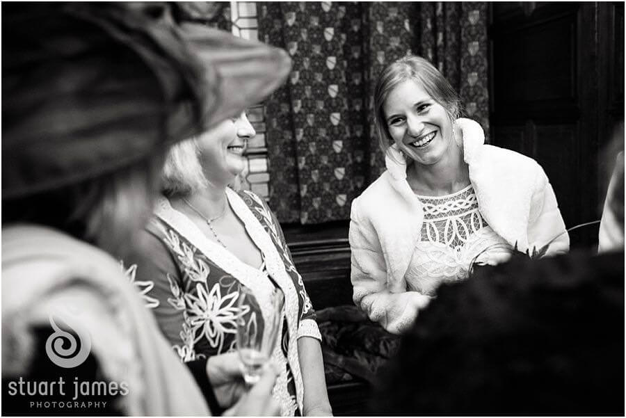 Candid photographs that show the emotion and excitement of the wedding guests greeting the newly married couple in the Gate House at Edinburgh Castle in Edinburgh by Edinburgh Documentary Wedding Photographer Stuart James
