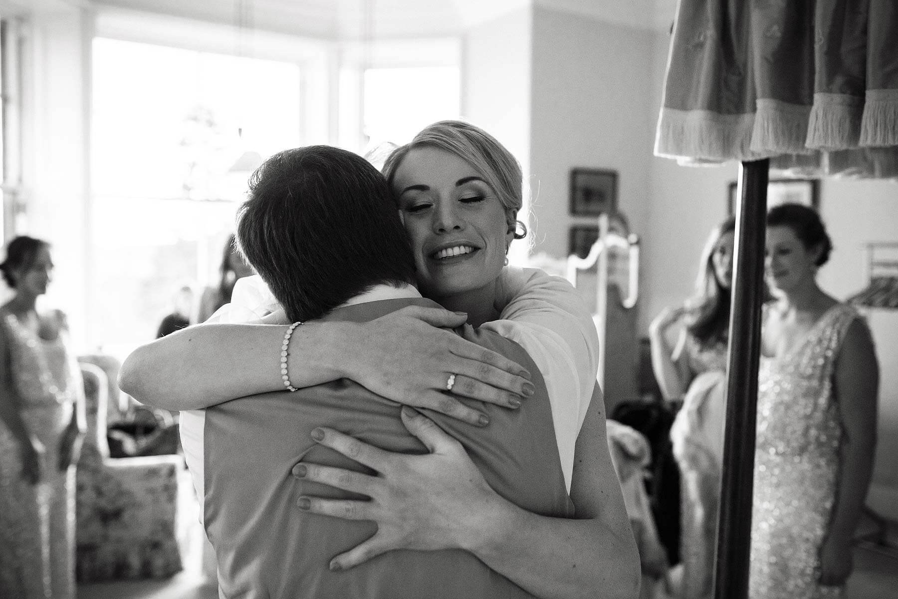 Reportage photographs capture the stunning moment the Bride and Father see each other at Sandon Hall in Stafford by Documentary Wedding Photographer Stuart James
