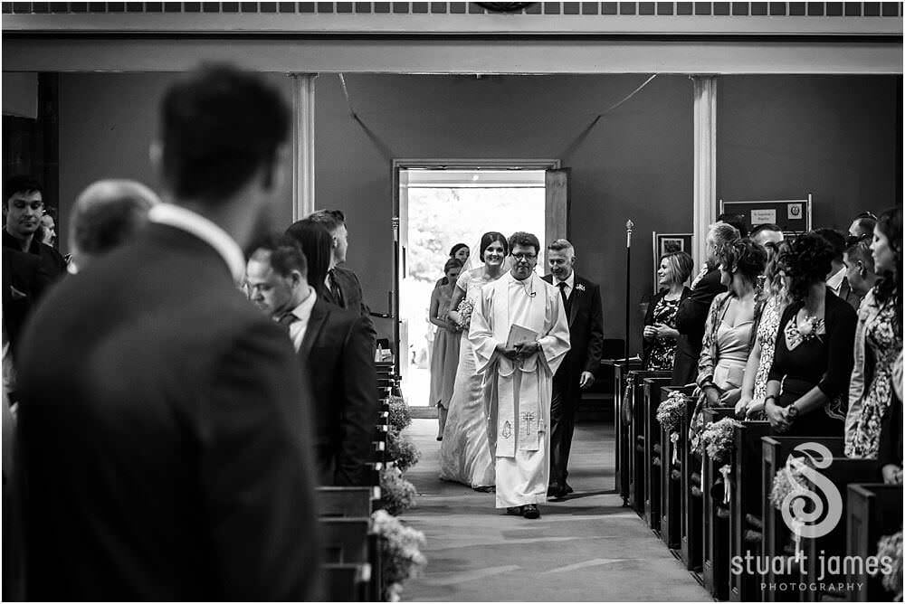 Photos that show the wedding ceremony at St Augustines Church in Rugeley by Documentary Wedding Photographer Stuart James