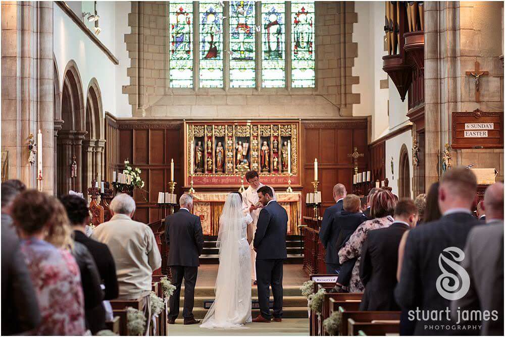 Photos that show the wedding ceremony at St Augustines Church in Rugeley by Documentary Wedding Photographer Stuart James