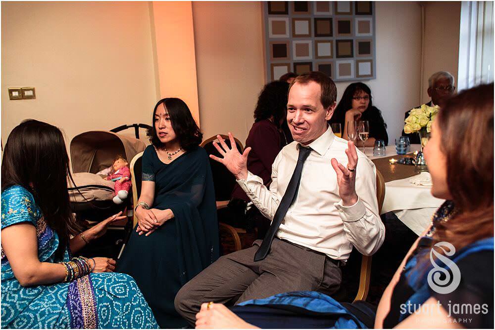 Reportage photographs as the Bride and Groom enjoy the wedding reception with the guests at the Mercure Hotel in Watford by London Documentary Wedding Photographer Stuart James