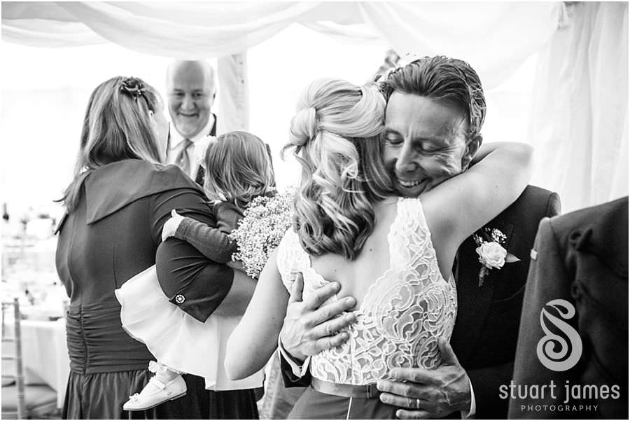 Capturing the fun of the wedding reception with creative candid photographs at Oxleaze Barn in Gloucestershire by Documentary Wedding Photographer Stuart James