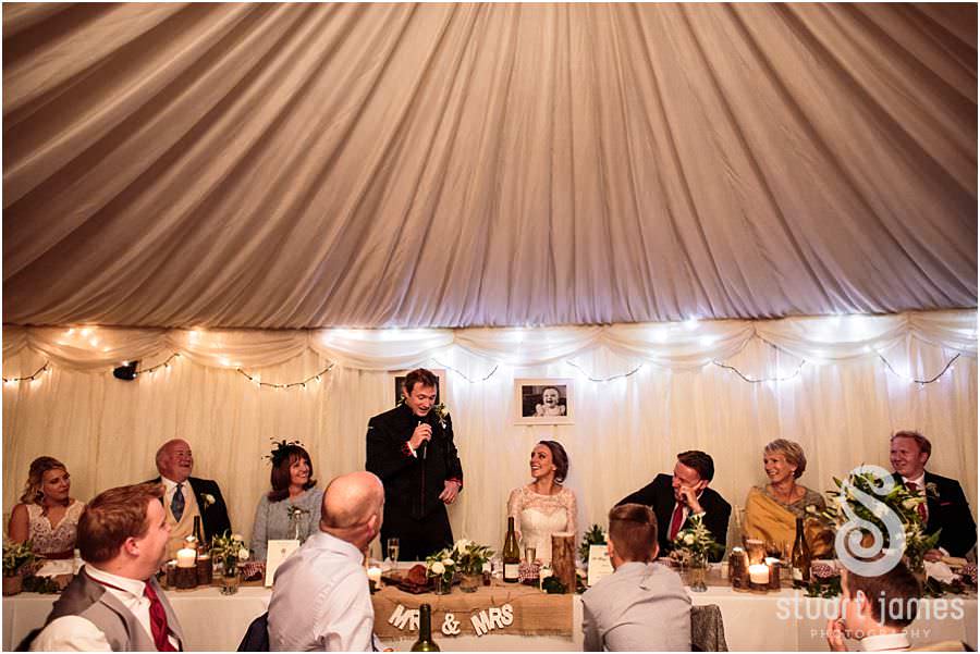 Capturing the feeling and emotion of the grooms speech at Oxleaze Barn in Gloucestershire by Documentary Wedding Photographer Stuart James