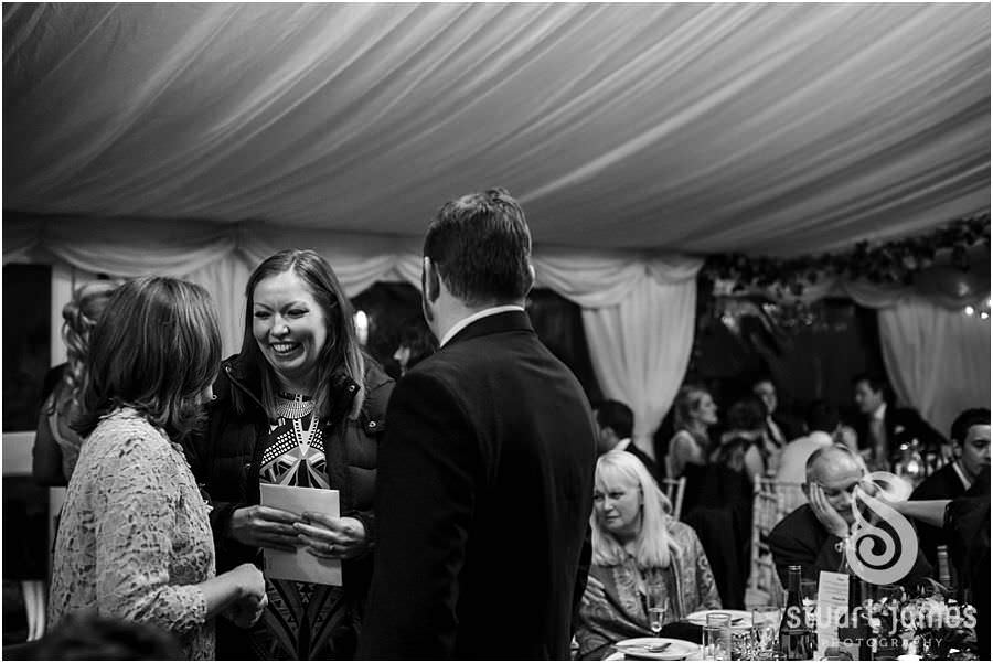 Creative documentary photos show the fun of the wedding reception at Oxleaze Barn in Gloucestershire by Documentary Wedding Photographer Stuart James