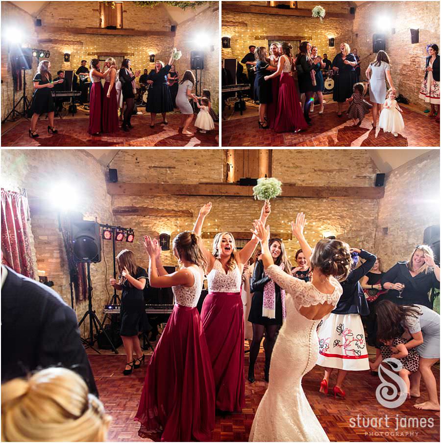 Fabulous bouquet toss at Oxleaze Barn in Gloucestershire by Documentary Wedding Photographer Stuart James